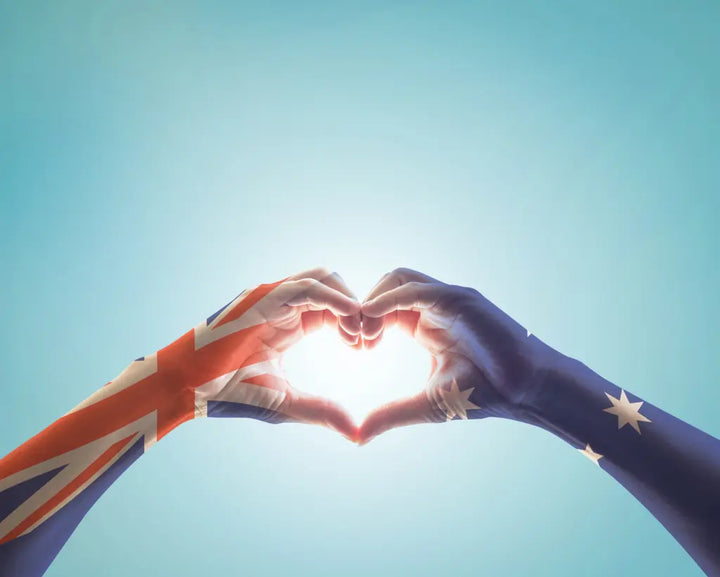 Two hands painted in Australian flag colors formed a heart shape