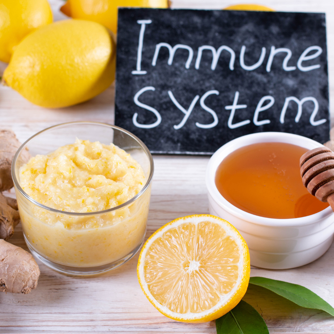 Cup of crushed ginger, orange, and honey with a blackboard sign saying Immune System